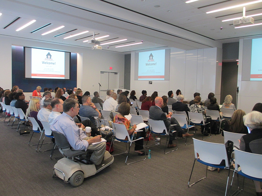 Audience waits for beginning of presentation at HRSA headquarters.