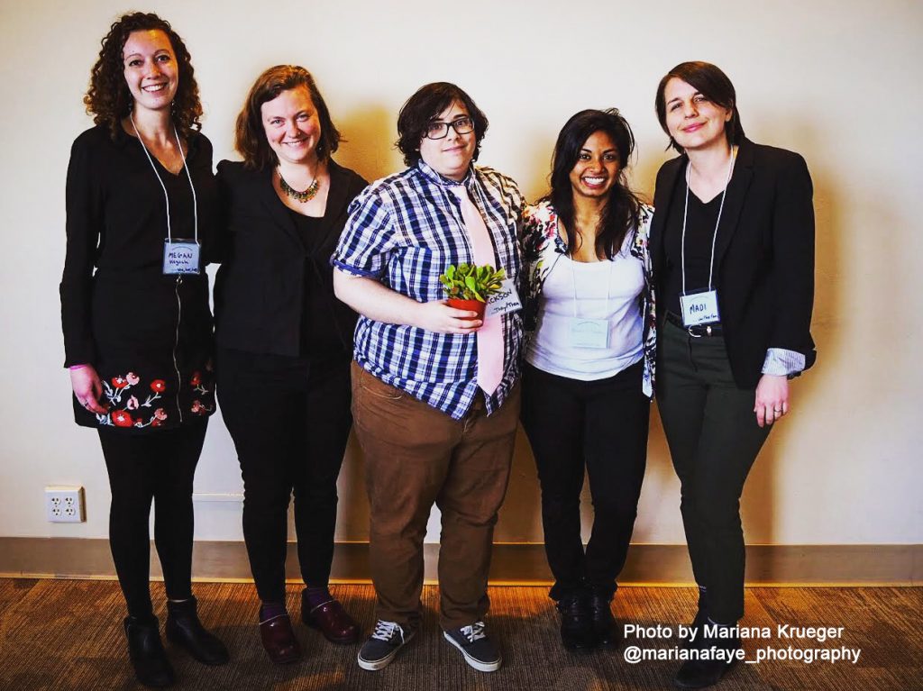 Planning team: Five people stand together facing the camera.